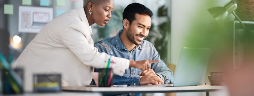 Office laptop, diversity teamwork and happy people review media application layout, creative design or research project Collaboration, designer or professional team working on app development report